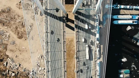 Aerial shooting over the cable bridge structure, cars driving over the bridge Stock Footage 107237346