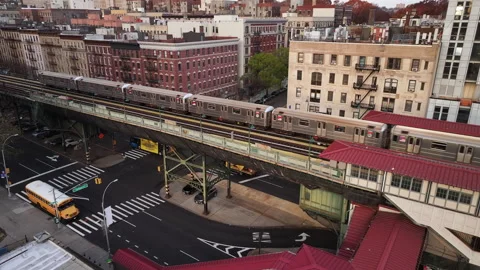Aerial shot of the 1 train passing through Harlem Stock Footage 256757034