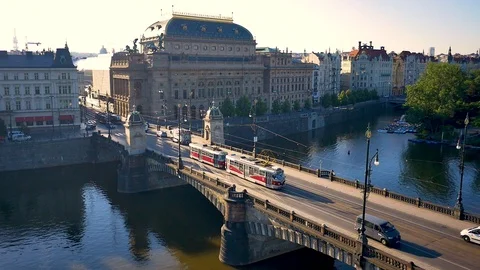 Aerial shot about river close to National Theatre with tram on the bridge in Stock Footage 103222686