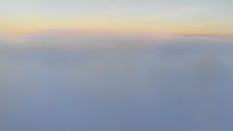 Aerial shot above thick clouds upper surface against horizon 스톡 동영상 103283172