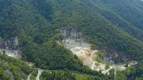 Aerial shot of the active marble quarry in the Carrara mountains, Italy Stock Footage 248704490