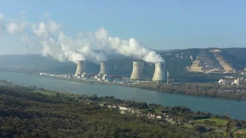 Aerial shot of an active nuclear power plant along a river, Cruas, France Stock Footage 292808723