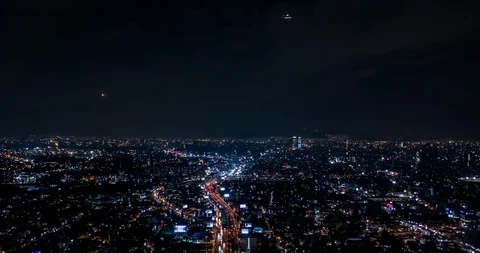 Aerial shot of the aerial traffic in Mexico City at night Stock Footage