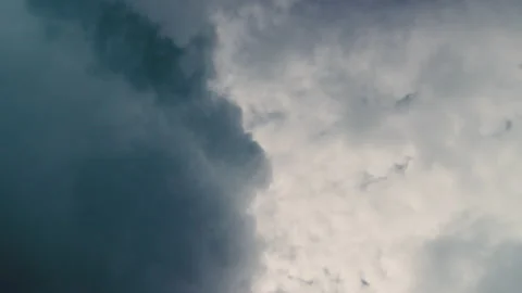 Aerial shot and movement between the clouds covering the sun Stock Footage 231252589