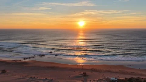 Aerial shot approaching the sunset over the Atlantic Ocean in Portugal Stock Footage 346657797