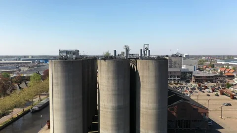 Aerial shot ascending in front of old feedmill CHV Stock Footage 106945003