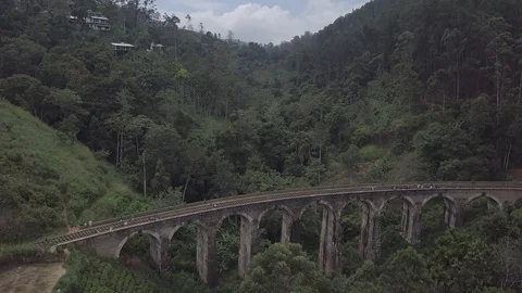 Aerial shot of authentic train bridge in the deep jungles of Ceylon Video stock 86703796