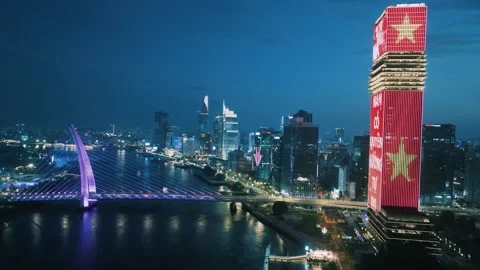 Aerial Shot of Ba Son Bridge and Saigon River Skyline at Night Video stock 341218110