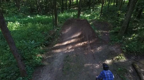 Aerial shot back view MTB BMX Bar Spin trick dirt jump Stock Footage 67504545