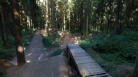 Aerial shot back view MTB BMX Trick-no hand dirt jump Stock Footage 67504631