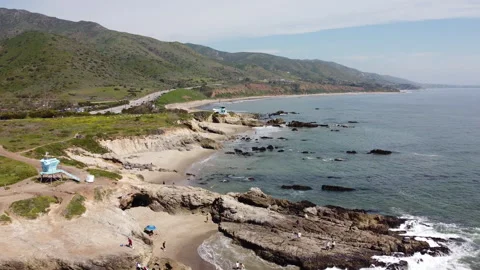Aerial shot backing out over Leo Carrillo state beach Malibu California Stock Footage 271103436