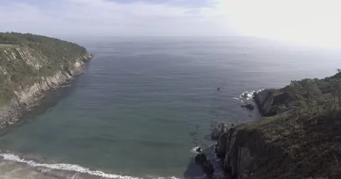 Aerial shot of beach on cliff with corn field in 4k Stock Footage 138071110