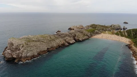 Aerial shot of beach with cliffs Stock Footage 114748334