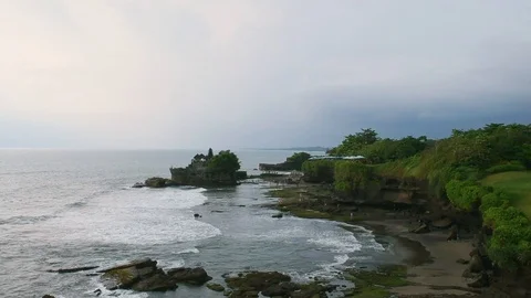 Aerial shot of beach with temple in the background in Bali, Indonesia Video stock 88729018