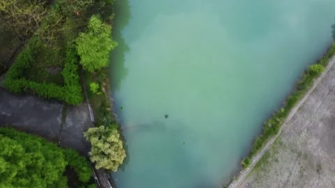 Aerial shot of beautiful blue lake top down Stock Footage