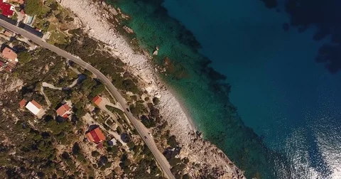 Aerial shot, beautiful transparent paradisiac sea and white stones on th Stock Footage