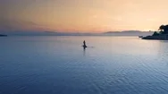 Aerial Shot Of A Beautiful Woman With  On A Standup Paddleboard. Stock Footage