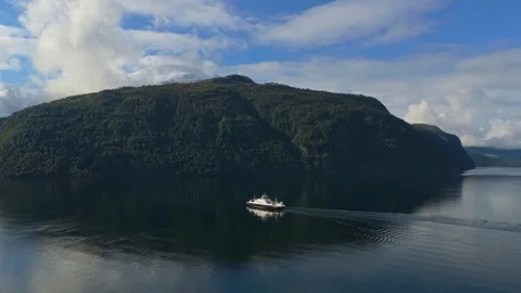 Aerial shot of boat reaching Eidsdal harbor on scenic Norwegian coast Stock Footage 320950275