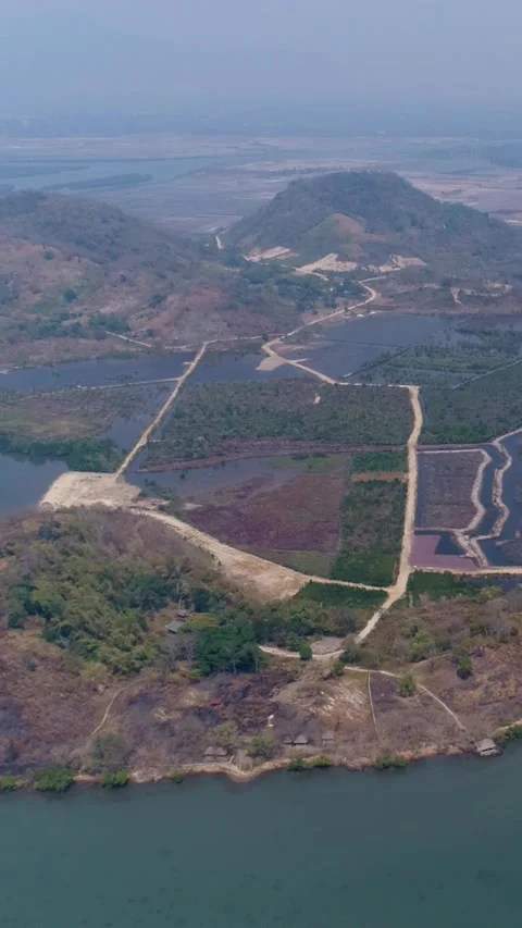 Aerial shot of the bottom tip of fish island in the southern part of Kampot city Stock Footage 224960314