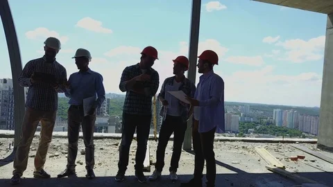 Aerial Shot Of Builders Team On Construction Site Discussing Plan Of Project Stock Footage