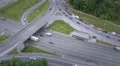 Aerial shot of busy road junction, fast and slow-driving cars HD Footage
