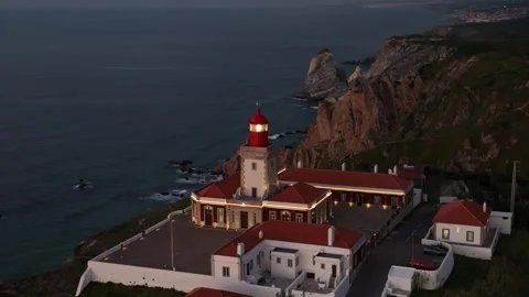 Aerial shot of Cabo Da Roca in amazing sunrise over blue ocean Stock Footage 297119264
