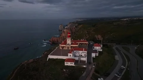 Aerial shot of Cabo Da Roca in amazing sunrise over blue ocean Stock Footage 297119425