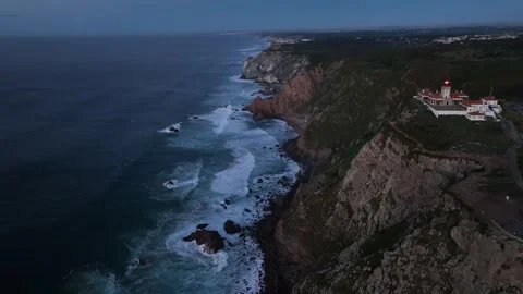 Aerial shot of Cabo Da Roca in amazing sunrise over blue ocean Stock Footage 297119428