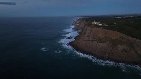Aerial shot of Cabo Da Roca in amazing sunrise over blue ocean Stock Footage 297119489