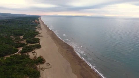 Aerial shot, calm sea in the fall on the sunset, in Tuscany, Italy, fil.. Vídeo Stock 76246853