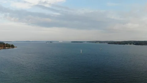 Aerial shot camera crane down on archipelago water Stock Footage 96653129