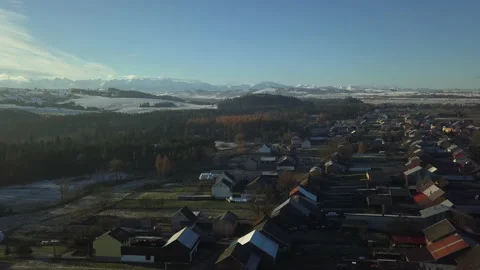 Aerial Shot. Camera flying over small town in Polish Tatra mountains. Sunrise.   Stock Footage 147628363
