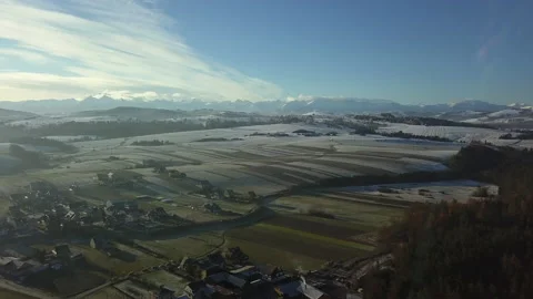 Aerial Shot. Camera flying over small town in Polish Tatra mountains. Sunrise.   Stock Footage 147631276