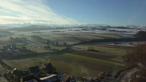 Aerial Shot. Camera flying over small town in Polish Tatra mountains. Sunrise.   Video stock 147631487