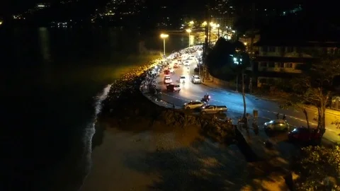 Aerial Shot Camera Rises on Beach Road at Night, Patong Vídeo Stock 85047807