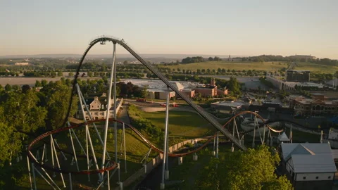 Aerial shot of Candymonium Roller Coaster at Sunrise Stock Footage 249695761