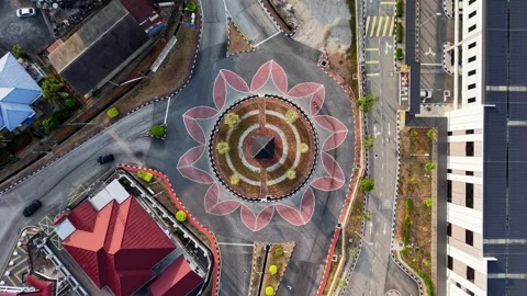 Aerial shot captures a circular intersection with a floral pattern Stock Footage 332610558