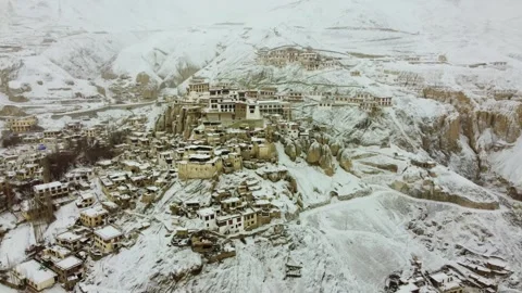 Aerial shot capturing Lamayuru Monastery and village amidst a snowfall. Stock Footage 310661083
