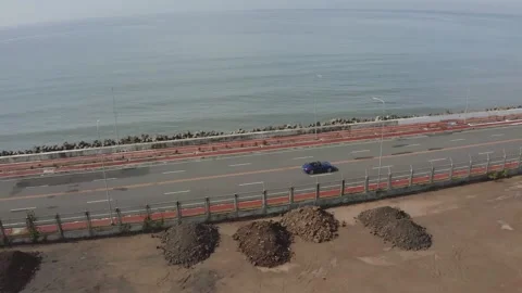 Aerial shot of car driving in empty road 動画素材 250970535