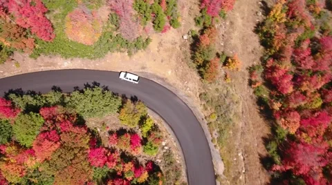 Aerial shot of a car driving on a mountain road Stock Footage