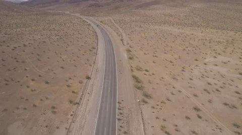Aerial shot of Car Driving through Death Valley Stock Footage