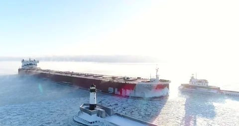 Aerial Shot Of Cargo Ship Sailing Through Lake Ice in Duluth 5.1 Stock Footage