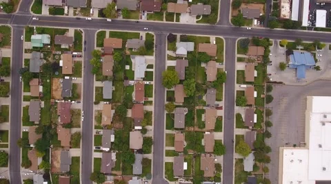 Aerial shot of cars on roads in city suburbs Stock Footage