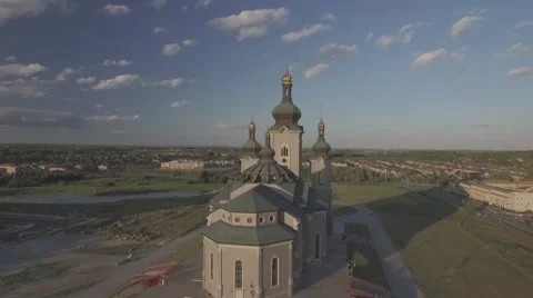 Aerial shot cathedral camera circle around during sunset Stock Footage 61109717