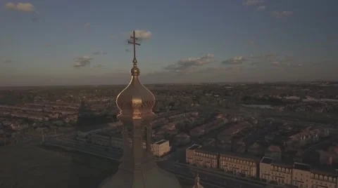 Aerial shot cathedral camera circle around the tip during sunset Stock Footage 61109774