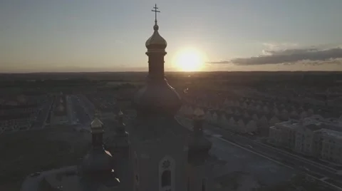 Aerial shot cathedral camera pull away during sunset Stock Footage 61109964