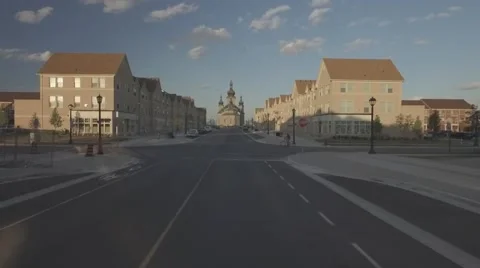 Aerial shot cathedral camera pull close through street during sunset Stock Footage 61110051