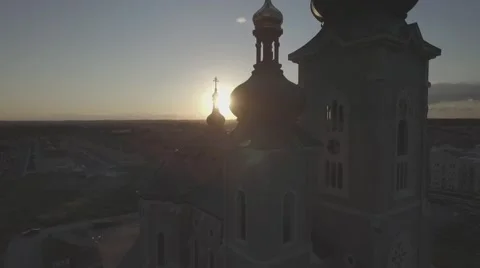Aerial shot cathedral camera pull up during sunset Stock Footage 61110144