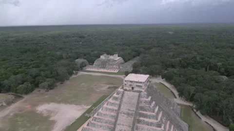 Aerial Shot Of Chichen Itza Amidst Trees Against Cloudy Sky, Drone Flying Stock Footage 152911232