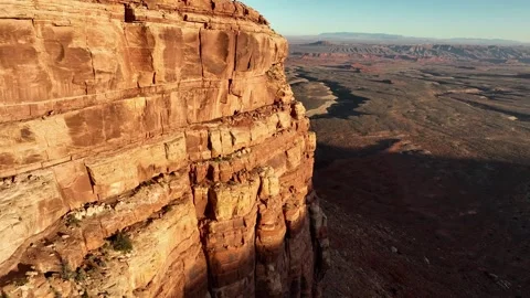 Aerial shot of the cliffs along the edge of Cedar Mesa in Southern Utah Stock Footage 337435648